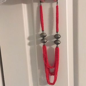 Long red statement necklace